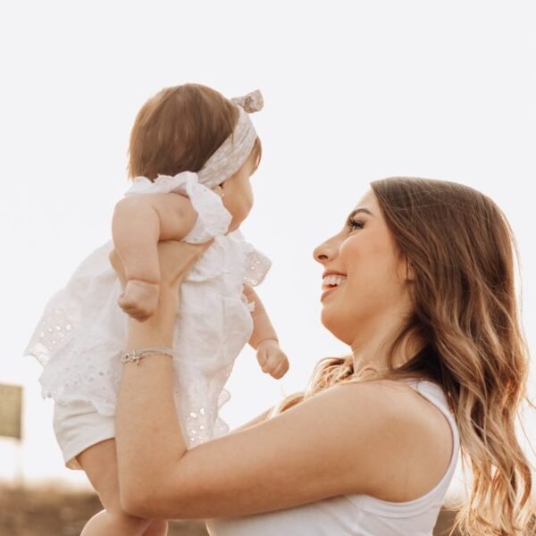 smiling mother holding baby